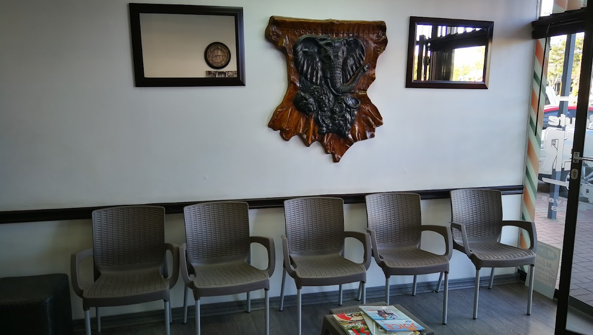 Waiting area with chairs and wall decor